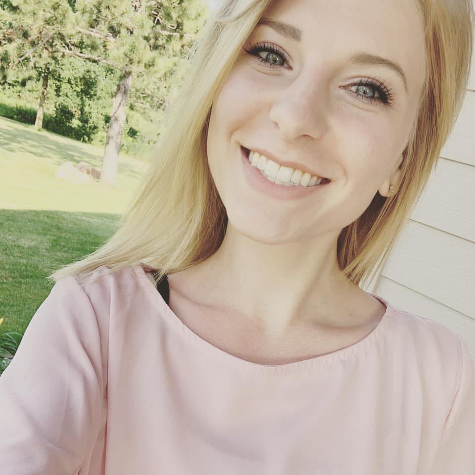 photo of allie traxler in a pink shirt outside