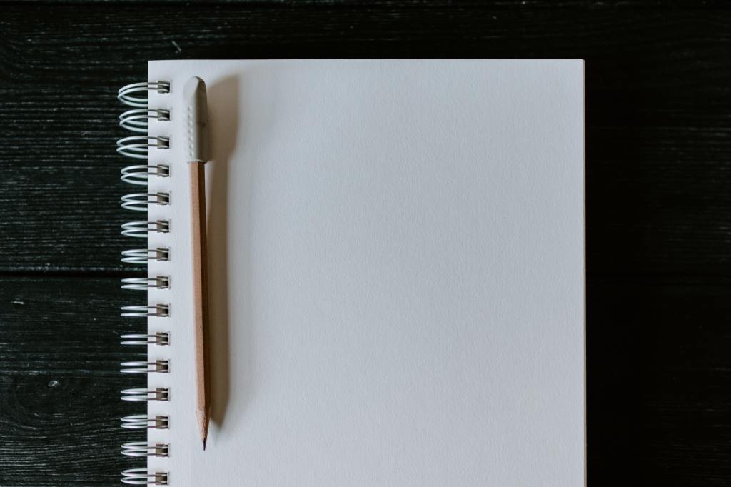 blank page with a pen, representing new beginnings