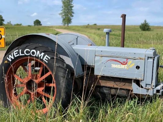 a close up of the Traxlers Hunting Preserve welcome tractor
